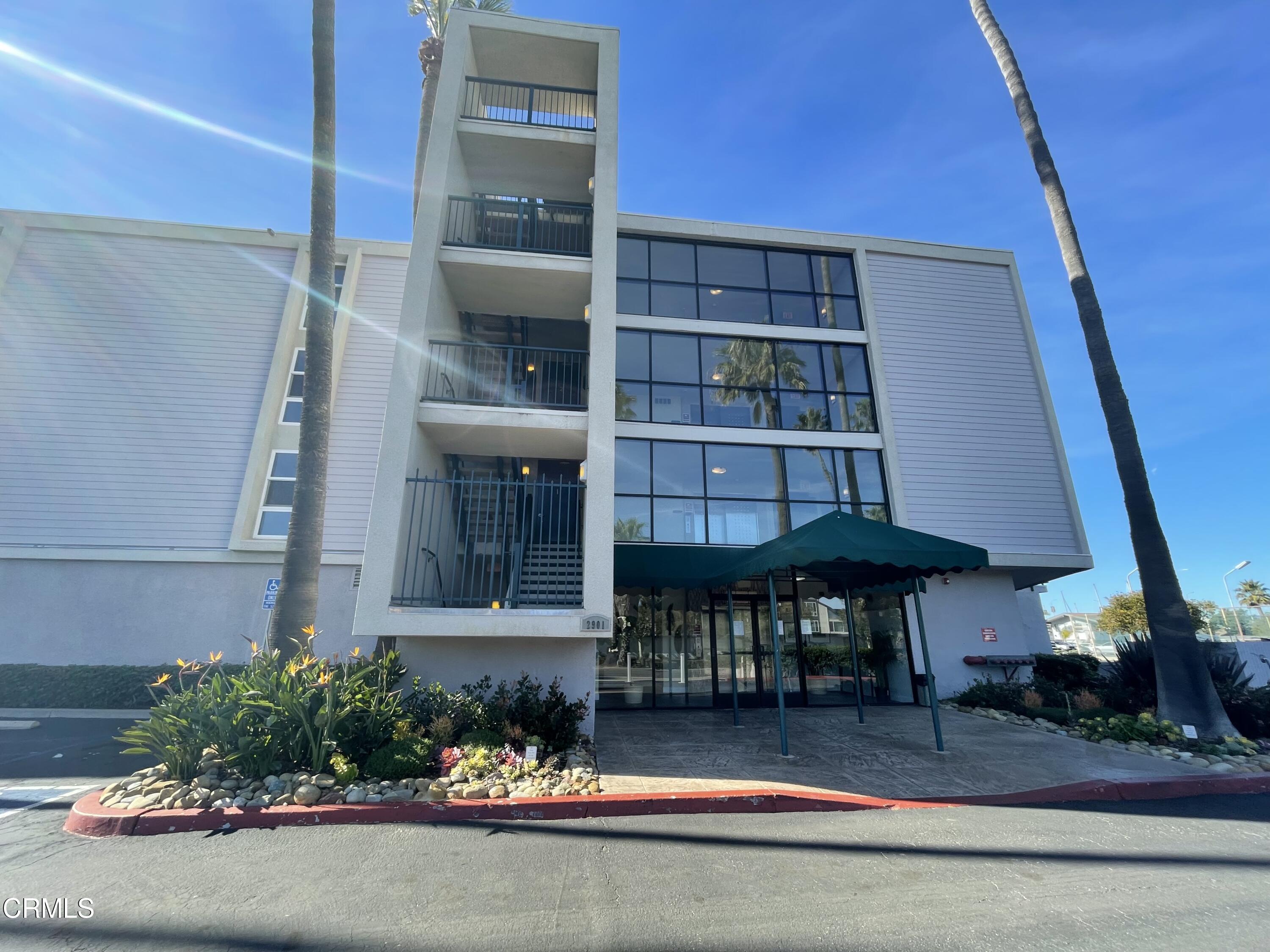 2901 Peninsula Road, Unit 144 Oxnard, CA 93035 - Photo 8 of 25 a front view of a house with a yard