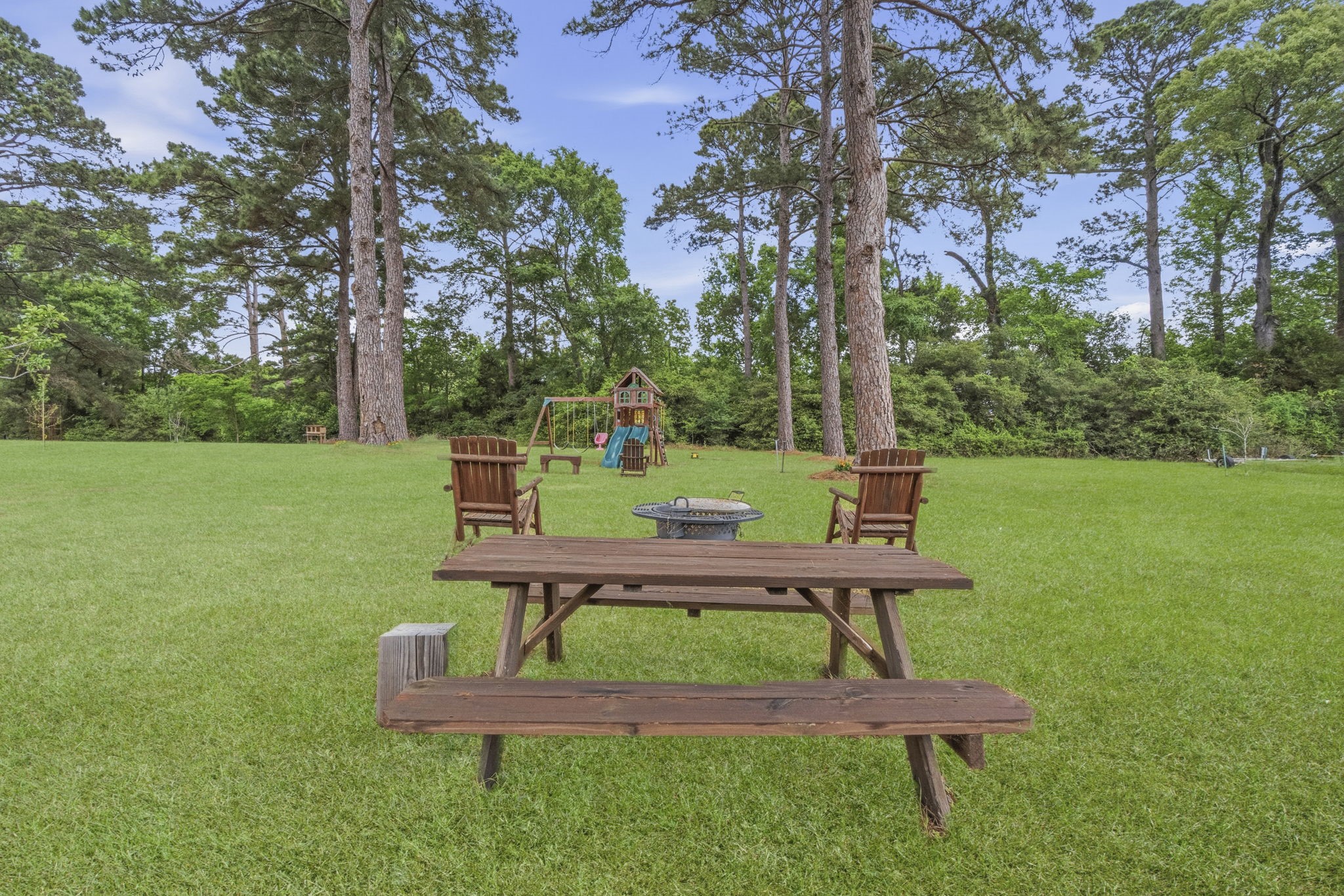 259 Memphis Bell Lane Trinity, TX 75862 - Photo 47 of 50 a view of a bench in a garden