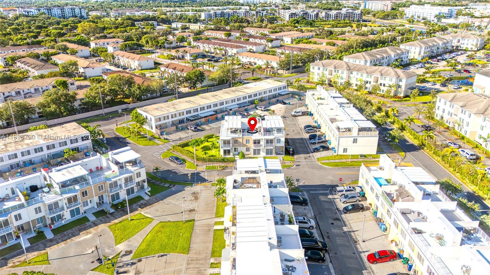 an aerial view of residential houses with swimming pool
