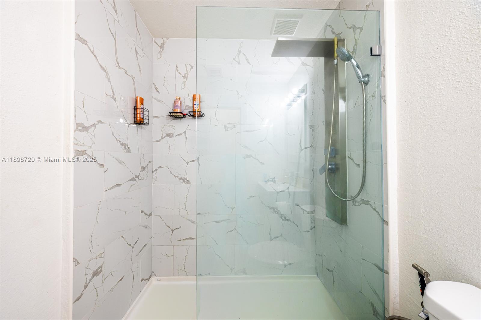 13966 Southwest 258th Street Homestead, FL 33032 - Photo 13 of 23 a bathroom with a shower and a toilet