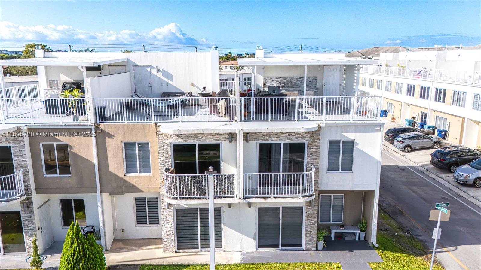 13966 Southwest 258th Street Homestead, FL 33032 - Photo 4 of 23 a view of a building with a lot of windows