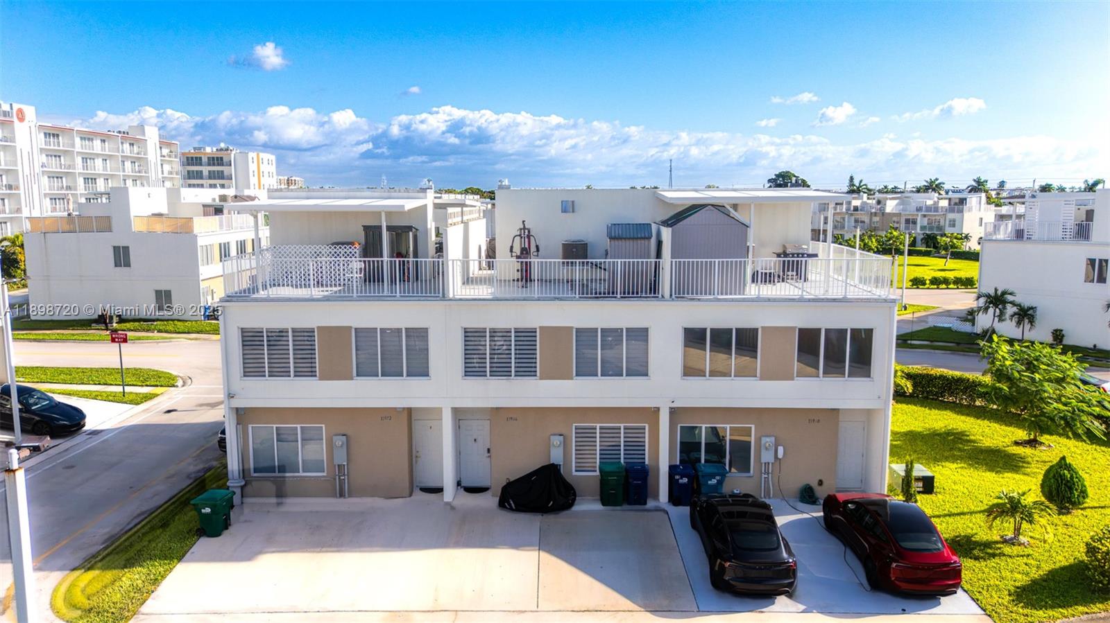 13966 Southwest 258th Street Homestead, FL 33032 - Photo 5 of 23 a view of a building with sitting area and swimming pool