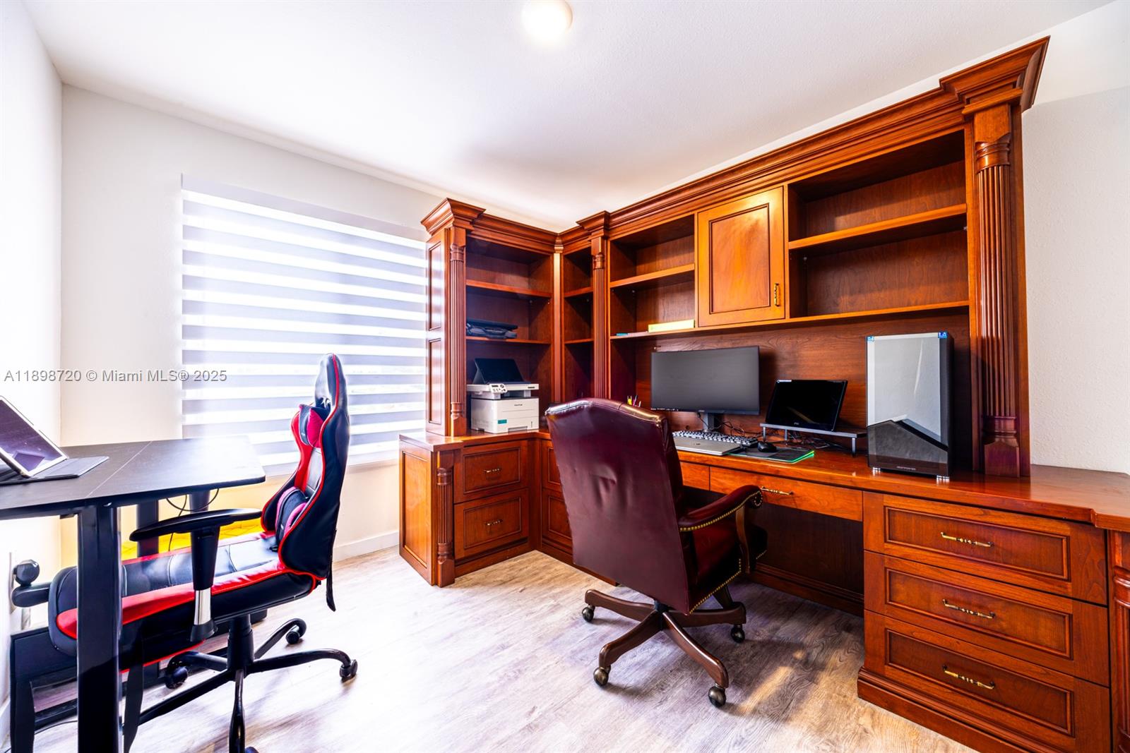 13966 Southwest 258th Street Homestead, FL 33032 - Photo 6 of 23 a view of a workspace with furniture and a window
