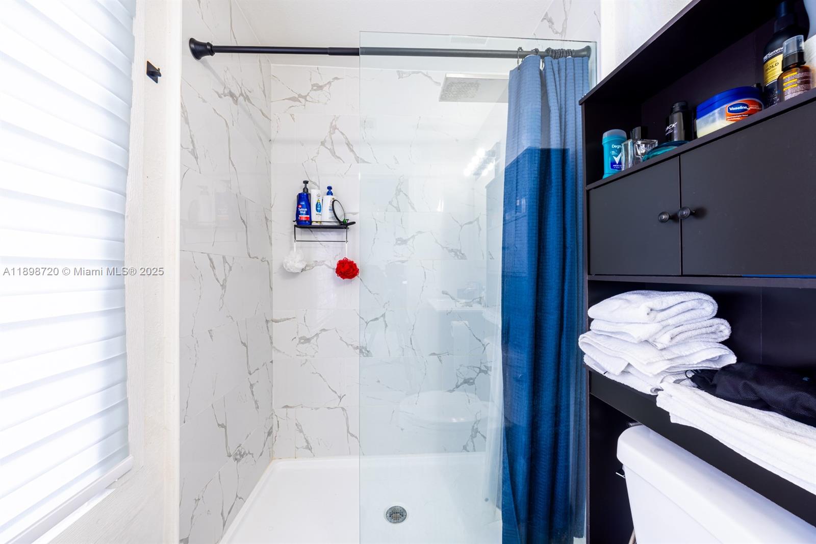 13966 Southwest 258th Street Homestead, FL 33032 - Photo 8 of 23 a bathroom with a shower and a sink