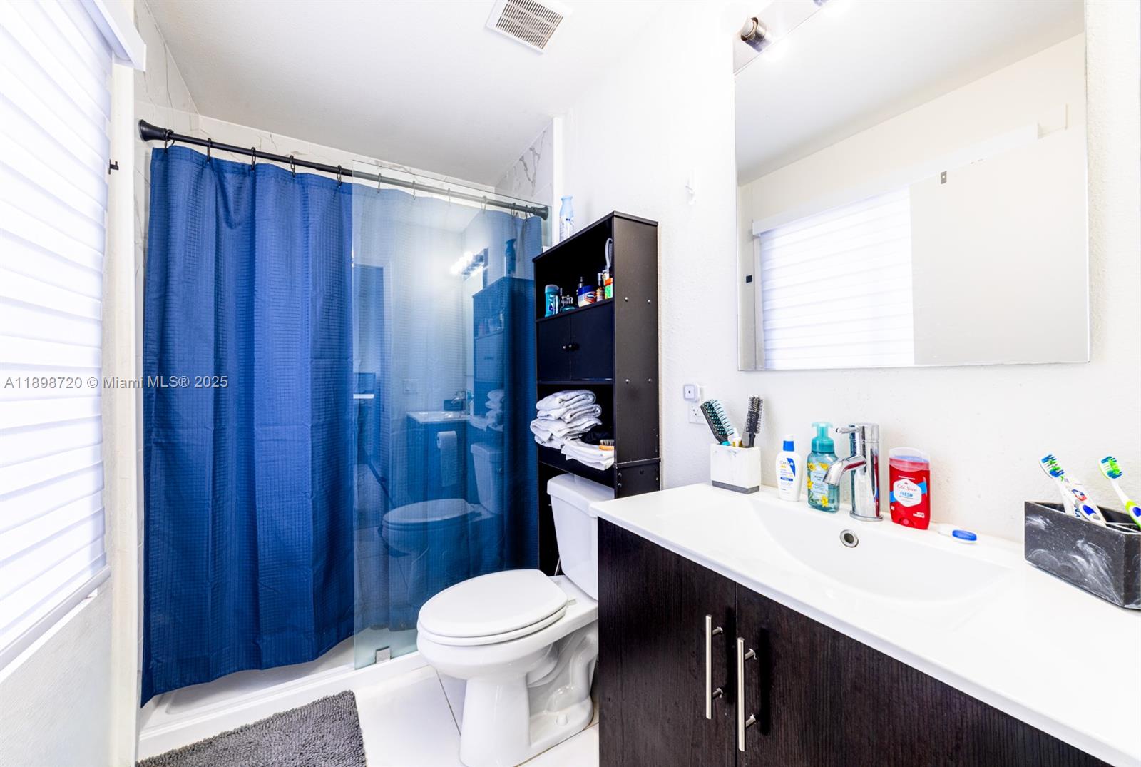 13966 Southwest 258th Street Homestead, FL 33032 - Photo 9 of 23 a bathroom with a sink a toilet and shower