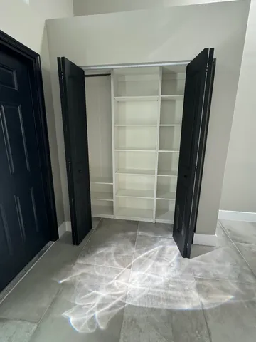 a view of a room with a large window