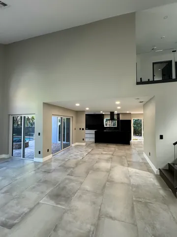 a kitchen with stainless steel appliances granite countertop a refrigerator and a stove