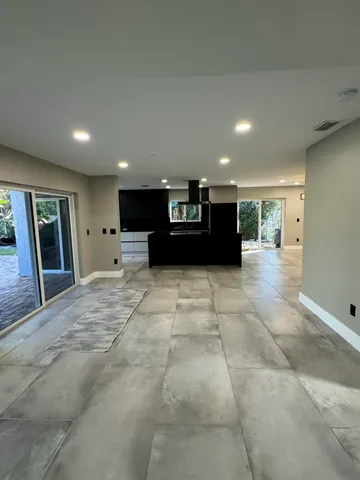 a kitchen with stainless steel appliances granite countertop a stove a microwave and a refrigerator