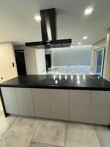 a large bathroom with a large tub and sink