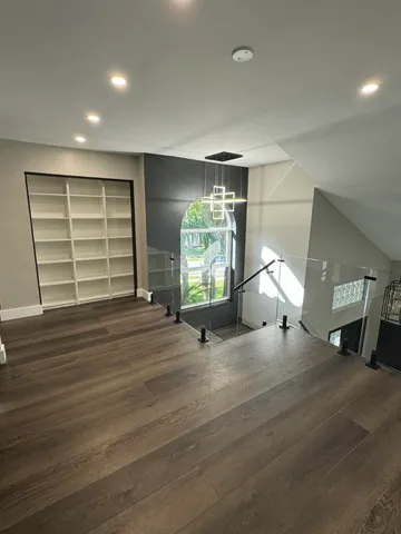 a kitchen with granite countertop a sink stove and refrigerator