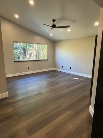 a bathroom with a bathtub toilet and shower