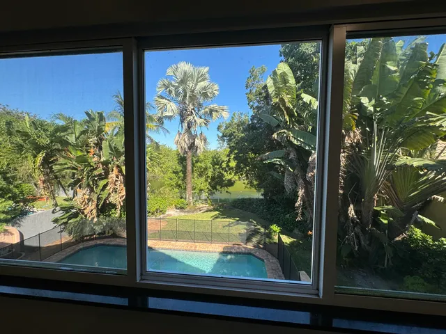 a view of a backyard with a garden