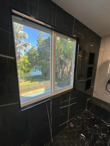 a backyard of a house with lots of green space