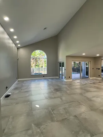 an empty room with wooden floor