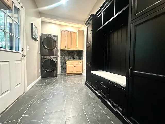 a bathroom with a sink and a washing machine