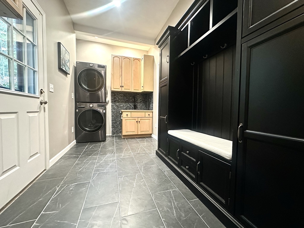 104 Channing Road Concord, MA 01742 - Photo 13 of 28 a bathroom with a sink and a washing machine