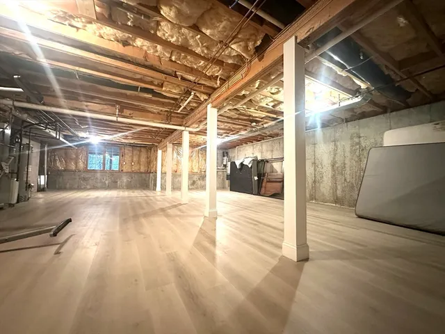 a view of a room with wooden floor