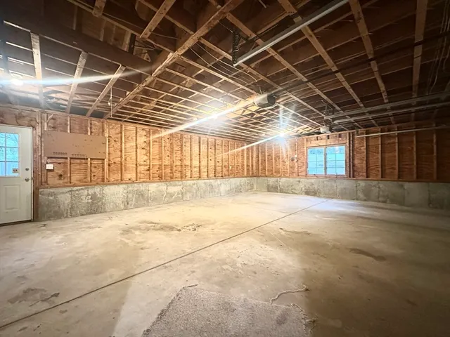 a view of empty room with wooden ceiling
