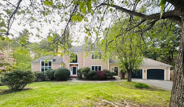 a view of house with yard and entertaining space