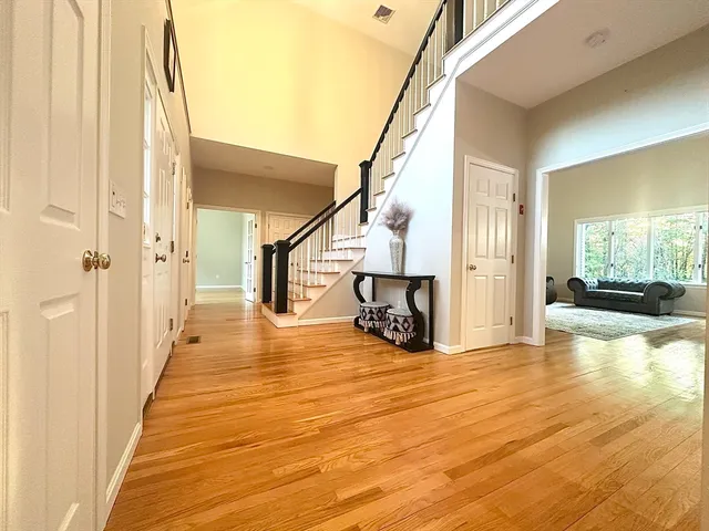 a view of an entryway with wooden floor