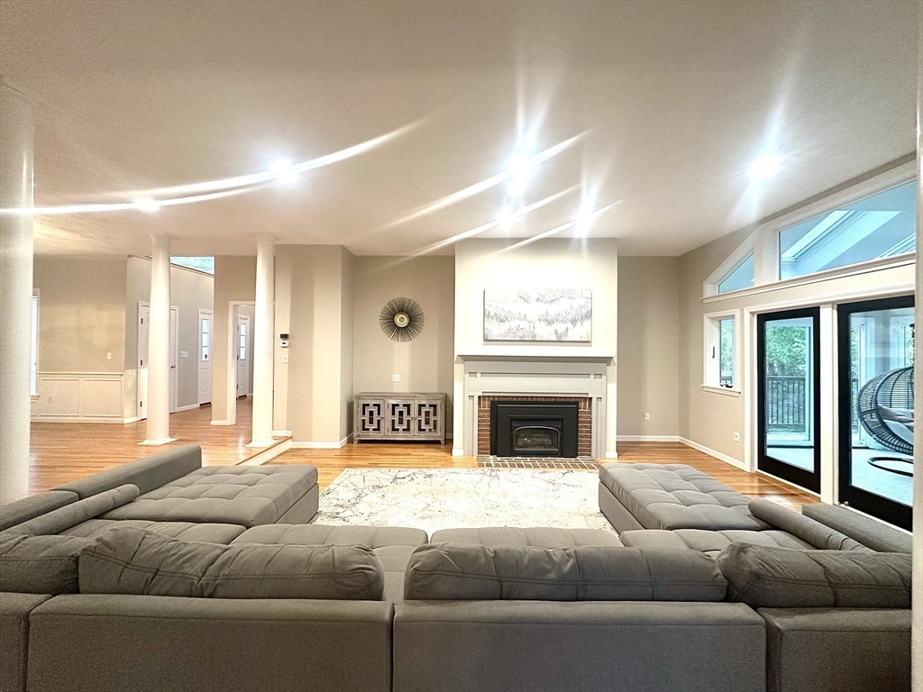 104 Channing Road Concord, MA 01742 - Photo 5 of 28 a living room with furniture and a fireplace