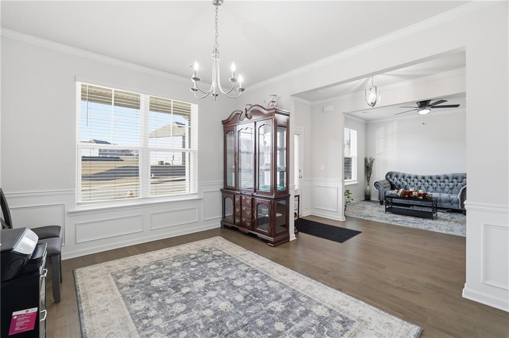 175 Paxton Lane Jefferson, GA 30549 - Photo 15 of 39 a living room with furniture and a chandelier