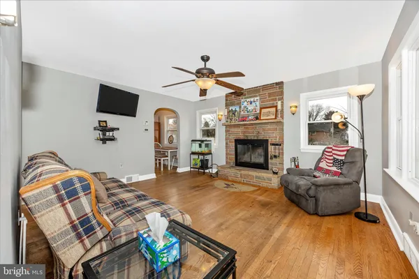 a living room with furniture fireplace and flat screen tv