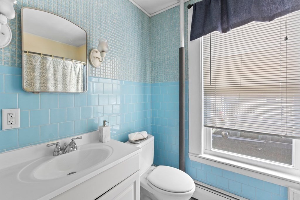 21 Boardman Street, Unit 1 Salem, MA 01970 - Photo 15 of 19 a bathroom with a sink a toilet and shower