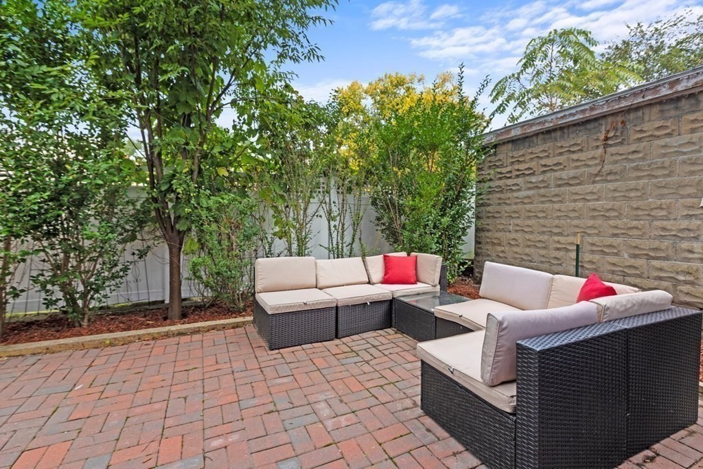 21 Boardman Street, Unit 1 Salem, MA 01970 - Photo 18 of 19 a outdoor space with patio the couches and a potted plant