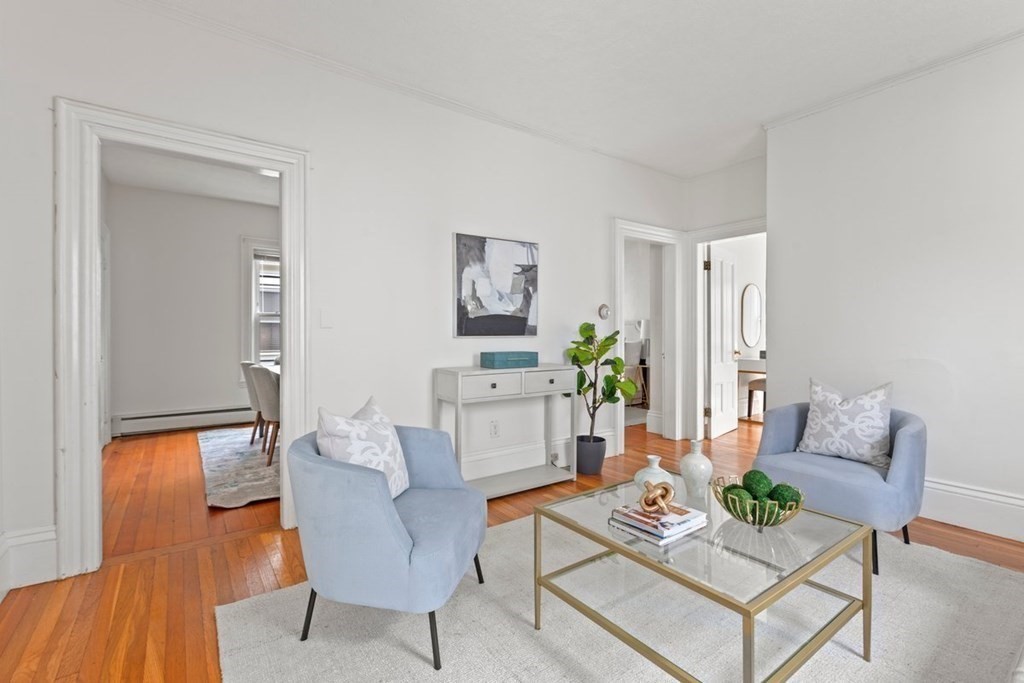 21 Boardman Street, Unit 1 Salem, MA 01970 - Photo 2 of 19 a living room with furniture and a wooden floor