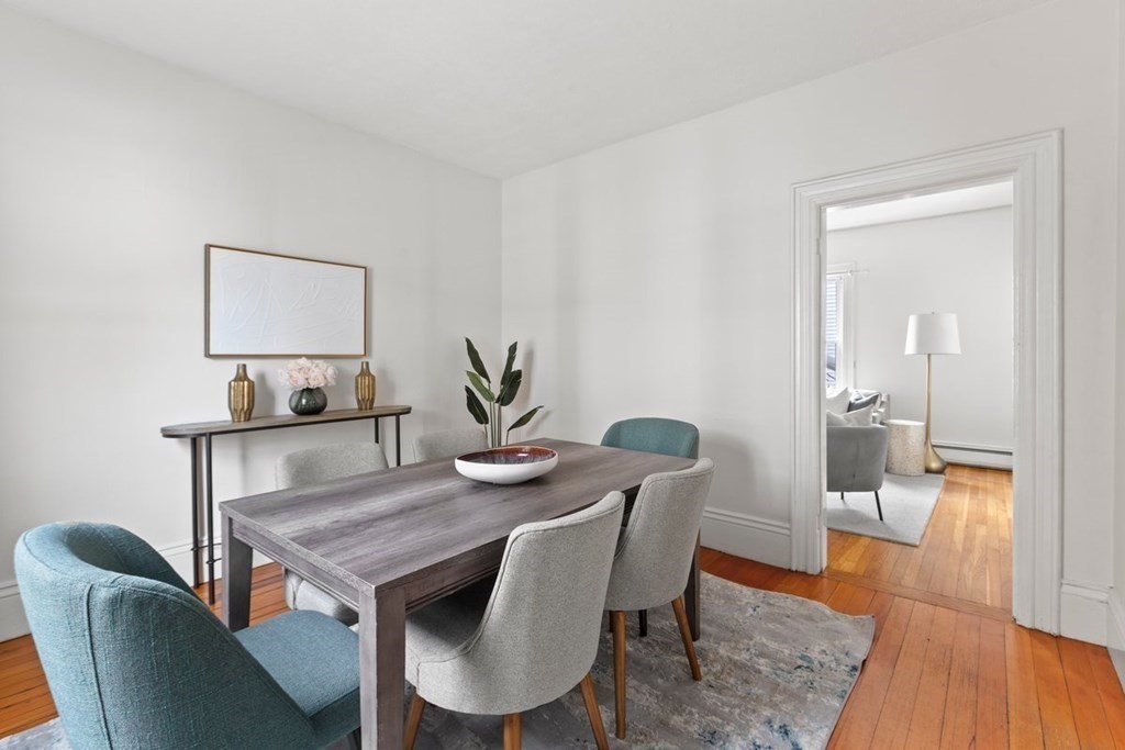 21 Boardman Street, Unit 1 Salem, MA 01970 - Photo 6 of 19 a view of a dining room with furniture and wooden floor