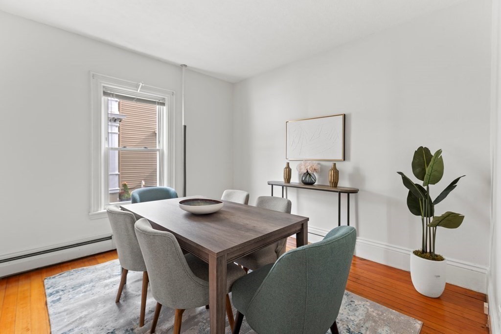 21 Boardman Street, Unit 1 Salem, MA 01970 - Photo 7 of 19 a view of a dining room with furniture window and wooden floor