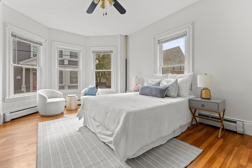 21 Boardman Street, Unit 1 Salem, MA 01970 - Photo 10 of 19 a spacious bedroom with a bed and wooden floor