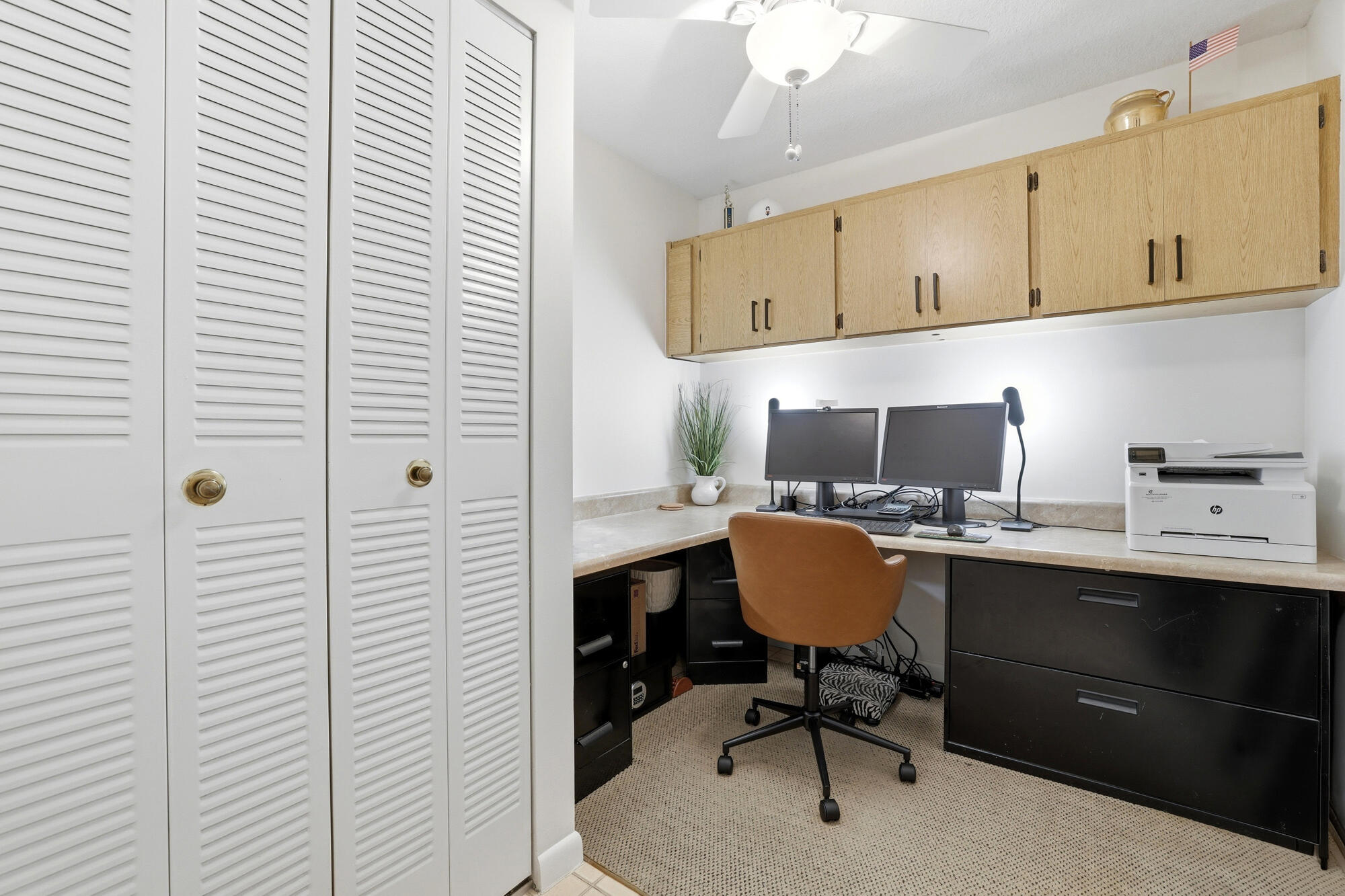 2101 Marina Isle Way, Unit 404 Jupiter, FL 33477 - Photo 12 of 17 a view of a workspace with furniture and a window