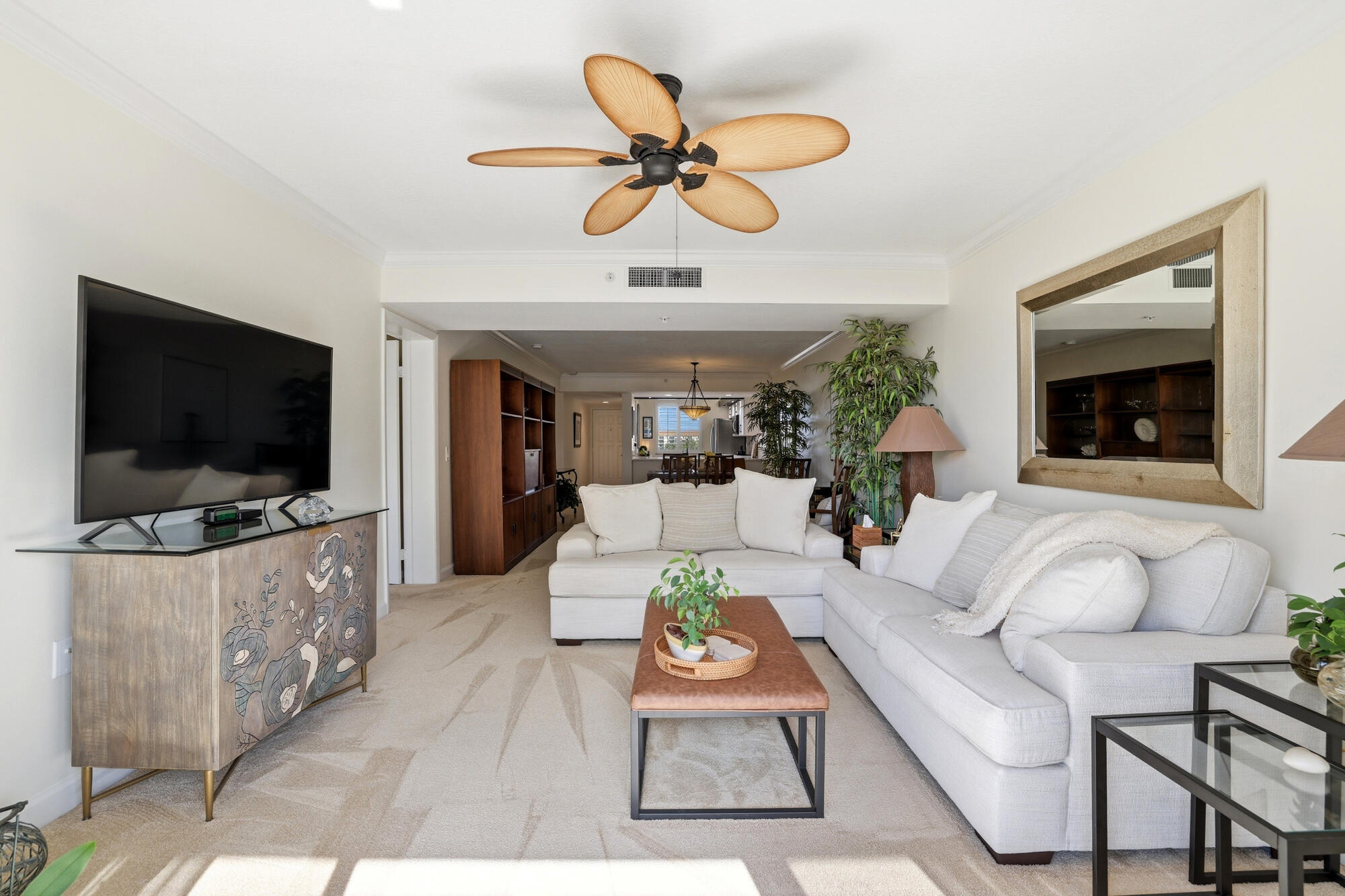 2101 Marina Isle Way, Unit 404 Jupiter, FL 33477 - Photo 5 of 17 a living room with furniture and a flat screen tv