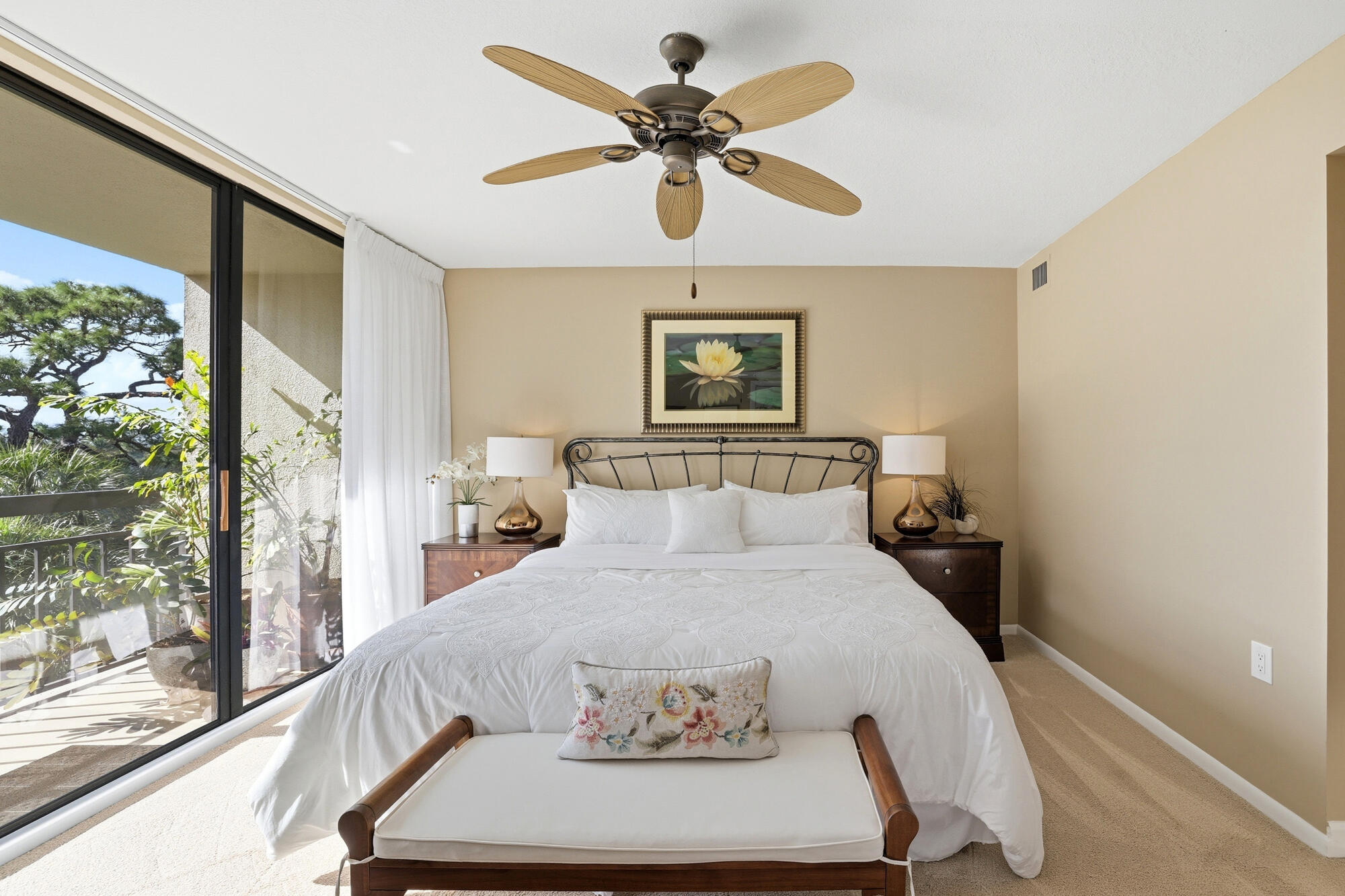 2101 Marina Isle Way, Unit 404 Jupiter, FL 33477 - Photo 6 of 17 a bedroom with a bed and a large window with outer view