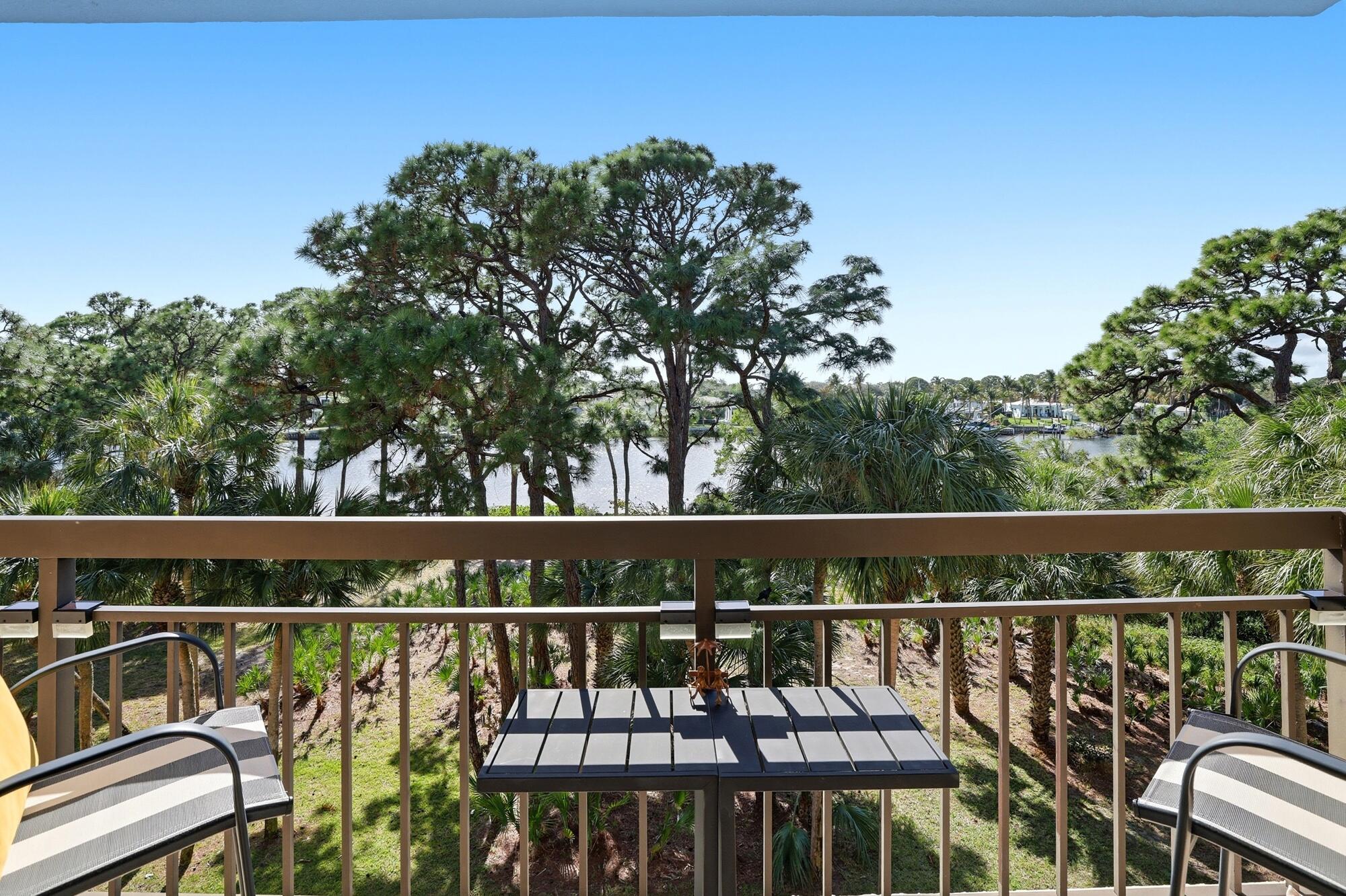 2101 Marina Isle Way, Unit 404 Jupiter, FL 33477 - Photo 8 of 17 a balcony with wooden floor and outdoor space