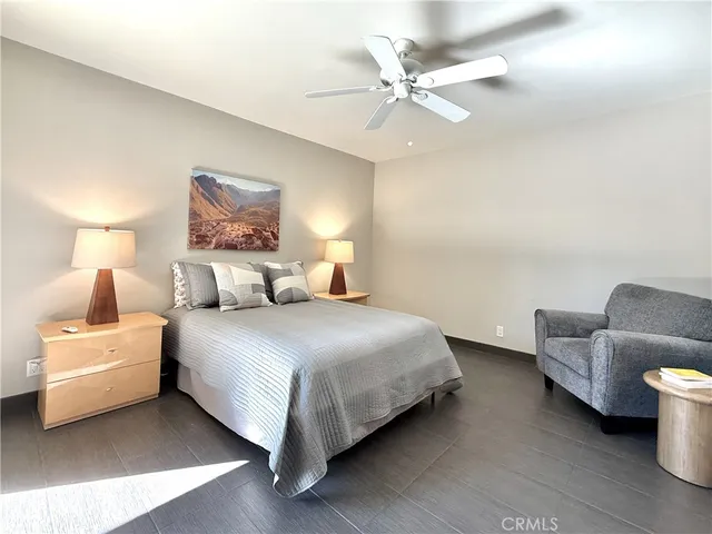 a bedroom with bed and a couch