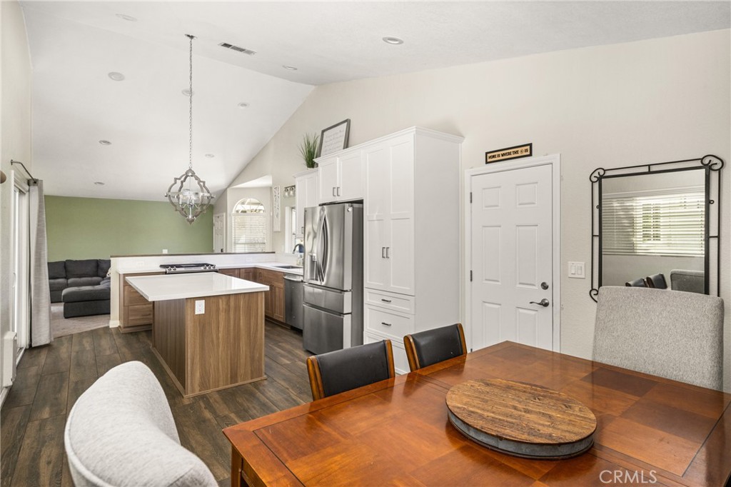 7958 East Bauer Road Anaheim, CA 92808 - Photo 13 of 45 a living room with stainless steel appliances furniture a rug and a kitchen view