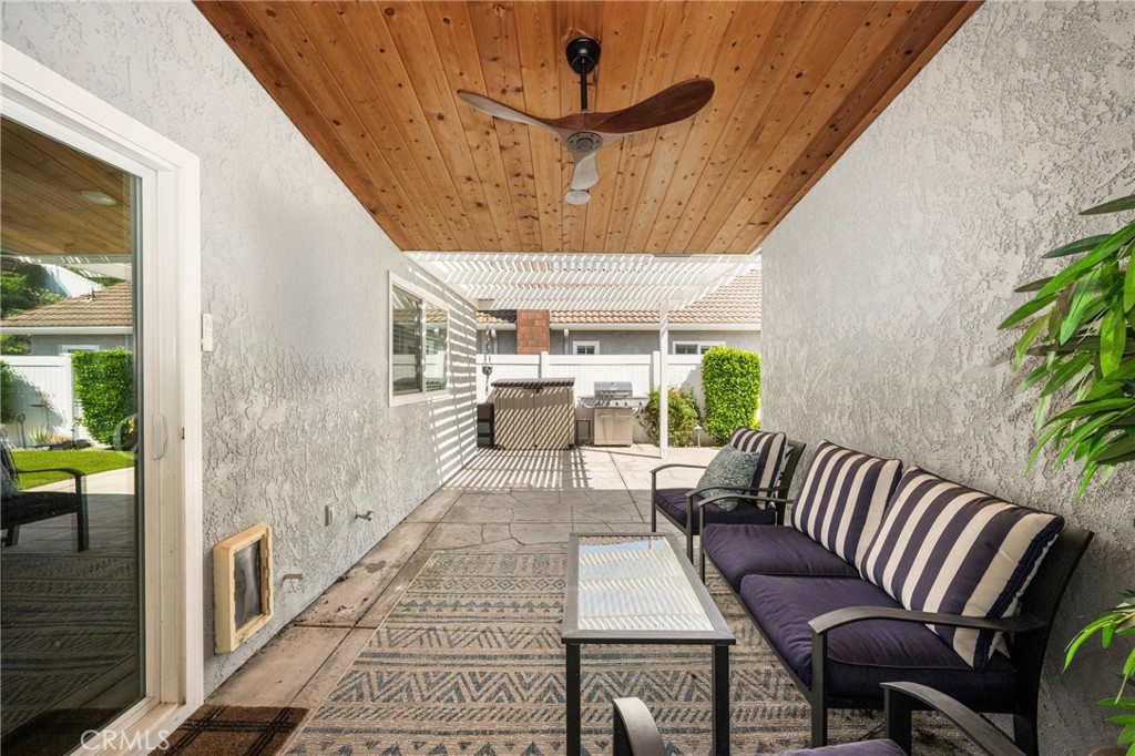 7958 East Bauer Road Anaheim, CA 92808 - Photo 15 of 45 a balcony with furniture and a potted plant