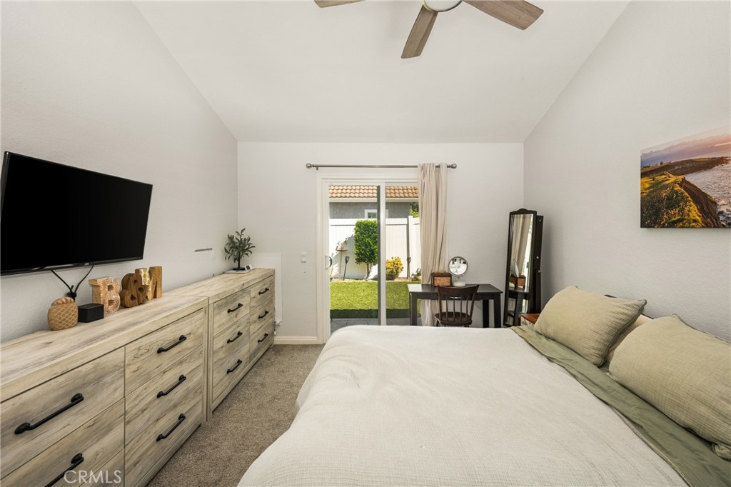 7958 East Bauer Road Anaheim, CA 92808 - Photo 22 of 45 a bedroom with furniture and a flat screen tv