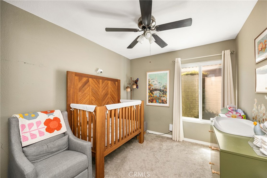 7958 East Bauer Road Anaheim, CA 92808 - Photo 29 of 45 a bedroom with a bed and wooden floor