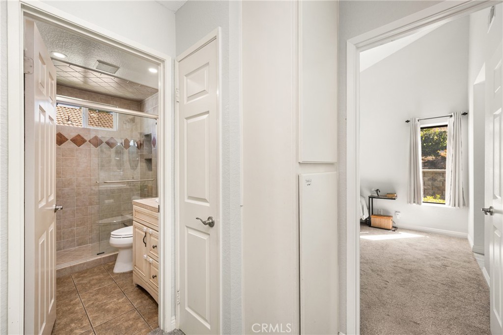 7958 East Bauer Road Anaheim, CA 92808 - Photo 30 of 45 a bathroom with a glass shower door