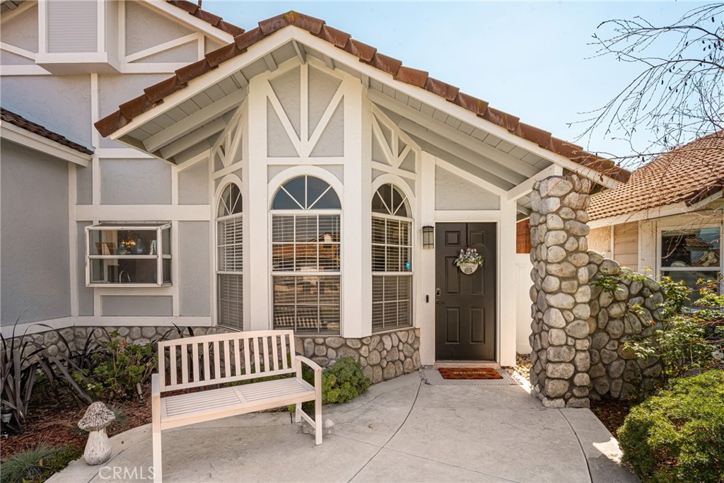 7958 East Bauer Road Anaheim, CA 92808 - Photo 3 of 45 a front view of a house with a garden