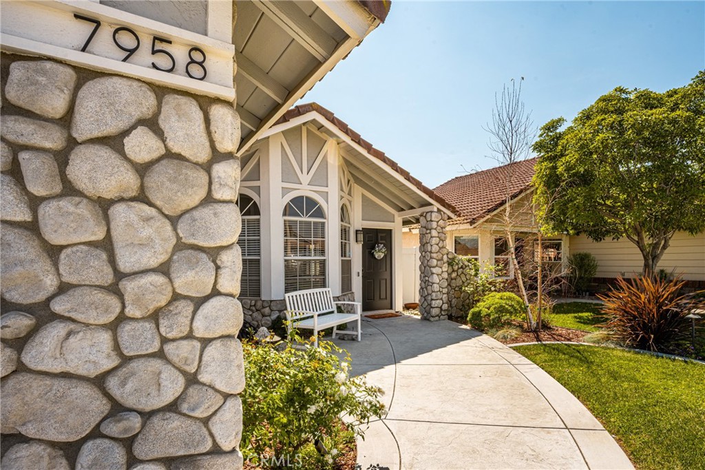 7958 East Bauer Road Anaheim, CA 92808 - Photo 4 of 45 a view of a street with potted plants and a building