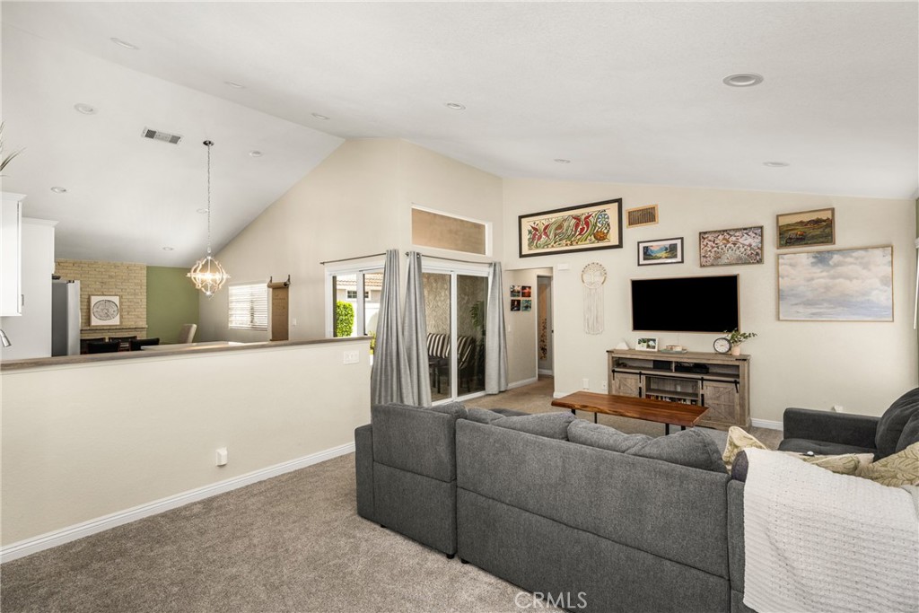 7958 East Bauer Road Anaheim, CA 92808 - Photo 6 of 45 a living room with furniture and a flat screen tv