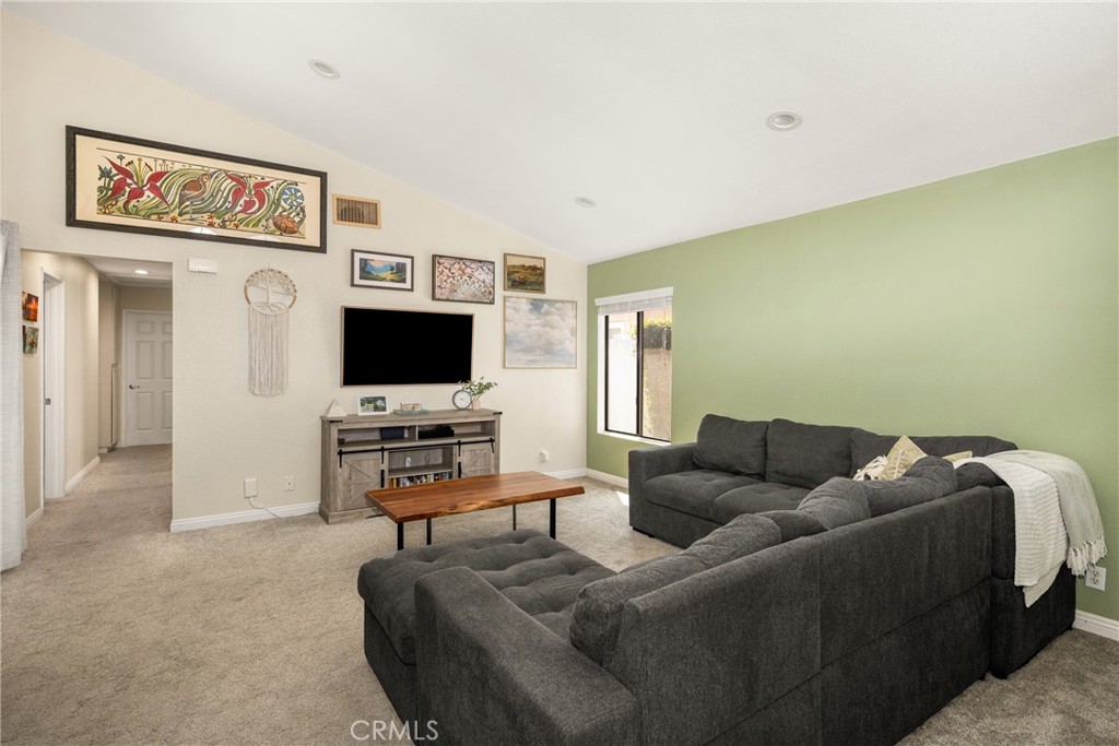 7958 East Bauer Road Anaheim, CA 92808 - Photo 8 of 45 a living room with furniture and a flat screen tv