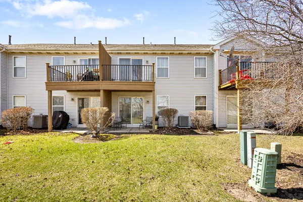 a front view of multiple house with outdoor seating