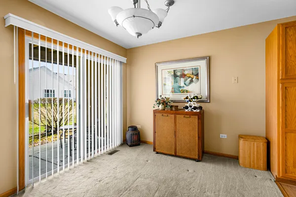a view of a room with furniture and windows