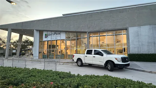 a view of a car parked in front of a building